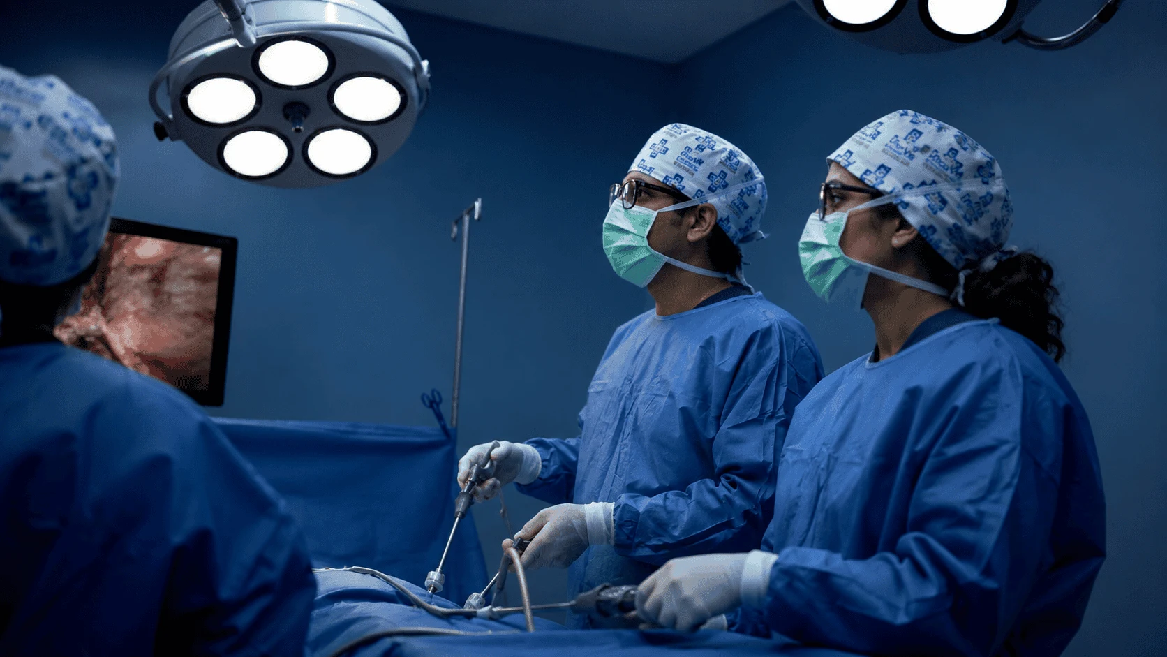 OncoVie surgeons performing a minimally invasive procedure in a modern operating theatre